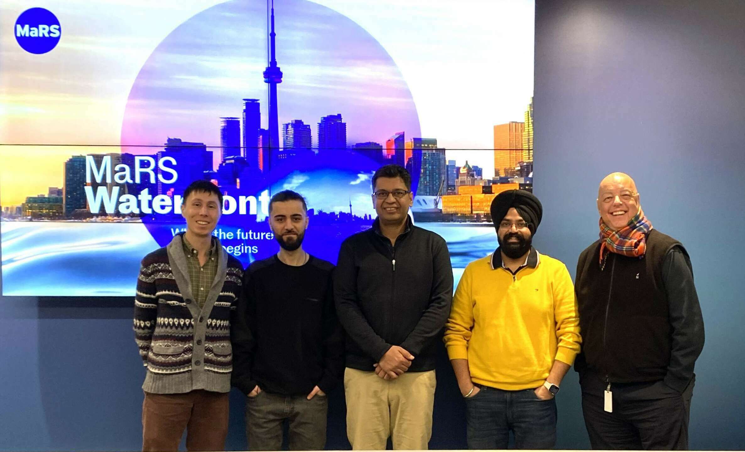 Toronto Global team smiling with XLSCOUT team at the MaRS Waterfront Innovation Centre.